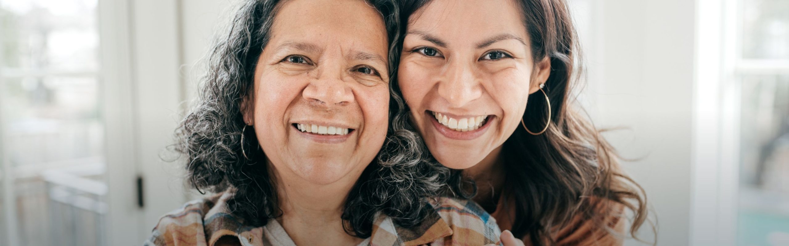 Adult woman smiles with her mother
